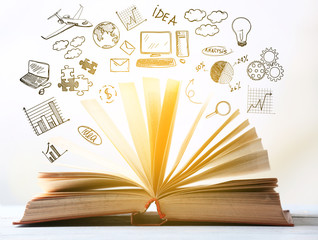 Open book on blurred bright background