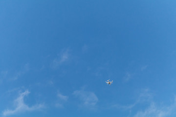 Drone flying in the blue sky