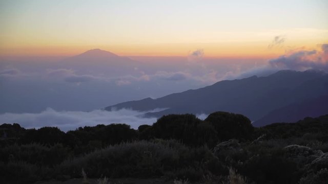 Sunset at Shira Huts Camp, Kilimanjaro. Africa, Tanzania. Kilimanjaro Summit Climb Trip. Sunset from Shira camp. Shira camp on Machame route Mount Kilimanjaro. rainforest in Africa. Jungle sunset
