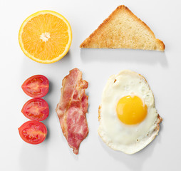 Tasty breakfast with fried egg on white background