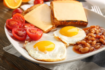 Tasty breakfast with fried eggs, closeup