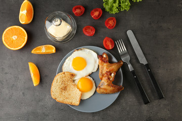 Fototapeta na wymiar Tasty breakfast with fried eggs on table