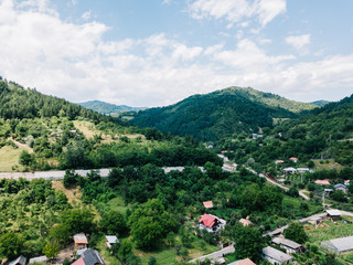 Obraz premium Aerial Drone Fly Over Carpathian Mountains Forest In Transylvania
