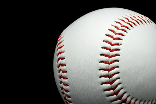 Isolated baseball on a black background and red stitching baseball.