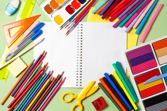 Back to school concept. School supplies on a pastel background