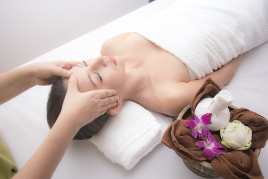 Close up of Beautiful young woman having head or face massage in spa salon wellness, Beauty healthy lifestyle and relaxation concept.