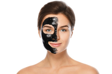 Beautiful woman with a black purifying mask on her face