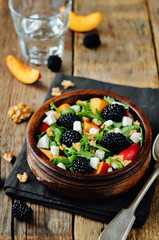 Arugula peach blackberry goat cheese salad
