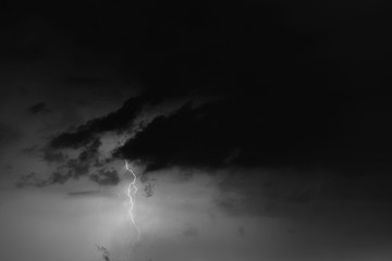 Lightning bolts against the backdrop of a thundercloud.