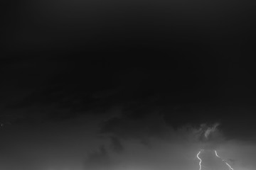 Lightning bolts against the backdrop of a thundercloud.