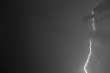 Lightning bolts against the backdrop of a thundercloud.