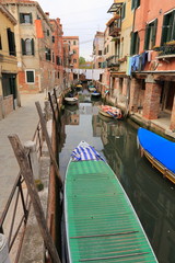 Fototapeta na wymiar Venice - April 10, 2017: The view on Canal in Venice, on April 10, 2017 in Venice, Italy