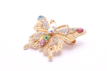 Brooch golden butterfly with diamonds isolated on white