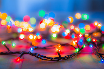 Colored lights Christmas garlands. Colorful abstract background. Blur and bokeh