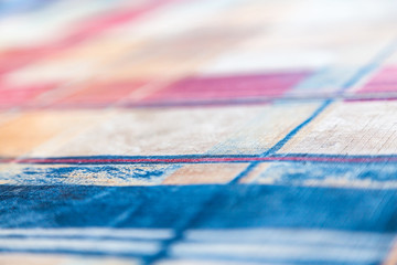 Multicolored textured background. Abstract pattern on fabric or paper.
