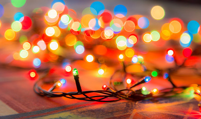 Colored lights Christmas garlands. Colorful abstract background. Blur and bokeh