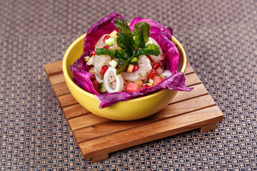 Vegetable salad with raw squid and shrimp.