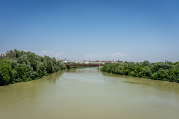 Fototapeta na wymiar The Guadalquivir river in Cordoba, Spain, Andalucia, Europe