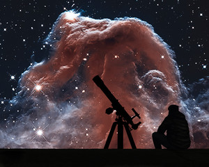 Man with telescope looking at the stars. The Horsehead Nebula in the constellation of Orion (The...