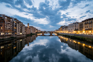 Fototapeta na wymiar View of the Bridge and Building along Arno river in Florence, Italy. At night.