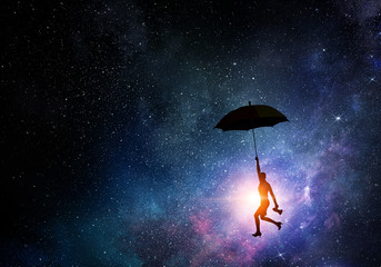 Woman flying on umbrella . Mixed media