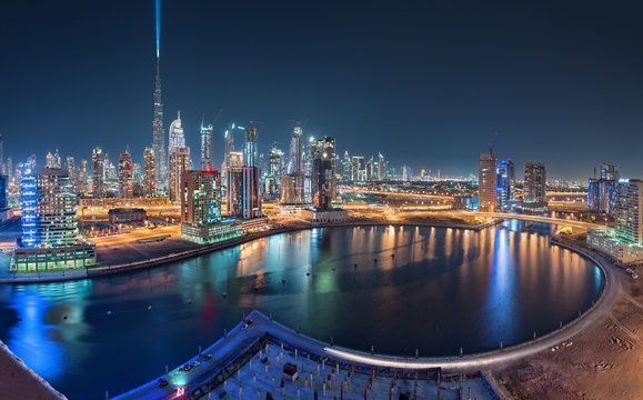 Dubai Business Bay at night with beautiful Towers and colorful reflections at night
