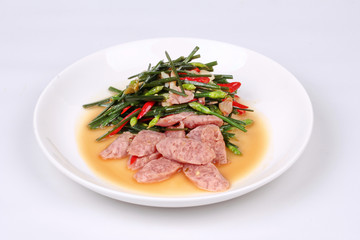 Fried Chinese chives with Thai sour sausage .
