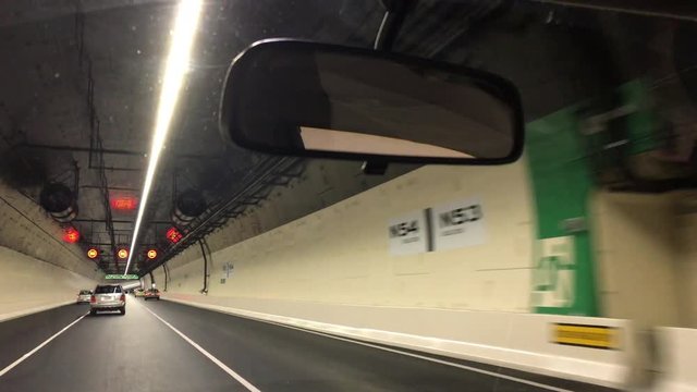 Car drive trough Waterview Tunnel in Auckland New, Zealand. At 2,400 metres (7,900 ft) long, it is New Zealand's longest road tunnel.