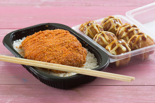 fried pork topped on rice  (tonkatsu) and Tako Yaki on Box