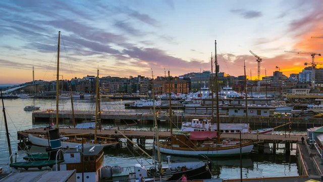 Oslo city Timelapse, Oslo port with boats and yachts at sunset in Norway, Time lapse 4k