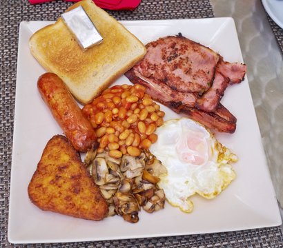 English Breakfast with sausage, mushrooms, egg, bacon, baked bea