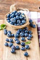 Tasty blueberries fruit in bowl. Blueberries are antioxidant organic superfood.