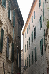 Fototapeta na wymiar Typical facades of the old houses in Kotor in Montenegro 