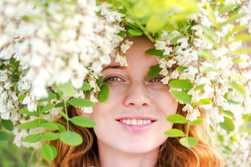 Redhead model among Flowers acacia