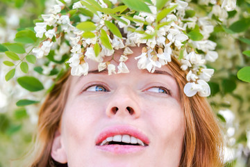 Redhead model among Flowers acacia