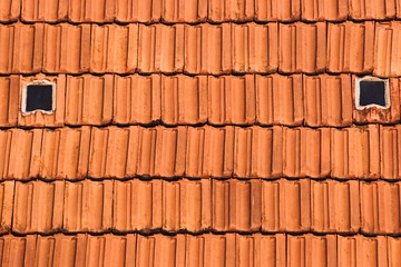Repeating pattern background of red tiles.