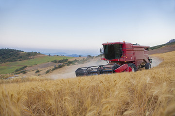 Obraz premium Combine at turning maneuver on mountain range area, Antequera, Malaga