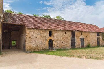 Fototapeta na wymiar Barn in ruin with former wooden door, in Burgundy, France 