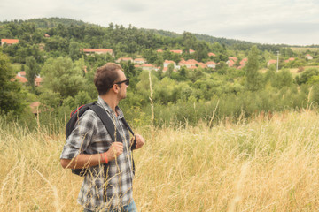 Young hiker in nature / wilderness - trekking outdoors.