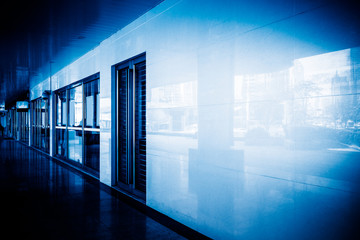 empty corridor of modern business building in blue tone.