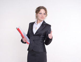 Businessman in a business suit with a red folder in his hands stands on a gray background