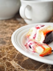Fruits and coffee cake with tea cup