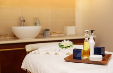 Fototapeta na wymiar Set for massage on table in spa salon