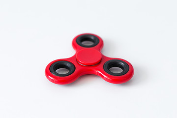 close up of popular toy fidget spinner over white table