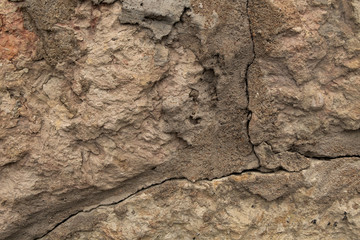 Stone wall with cracks. Texture photo. Background for your design.