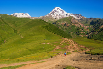 Mount Kazbek (5033 meters) view from Stepantsminda town in Georgia in good weather for climbing. It...