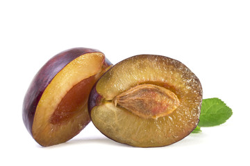 Two halves of open juicy plum