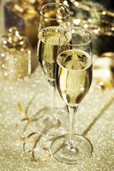 Holiday setup with sparkling wine in flute glasses and Christmas decorations