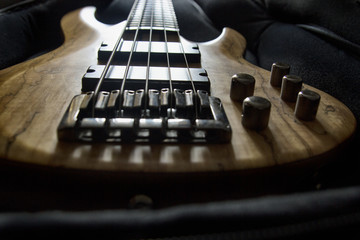 Bass guitar in the case, close up