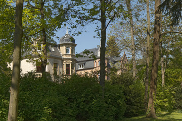 Fototapeta na wymiar Aschaffenburg – Villa in a park against a blue sky